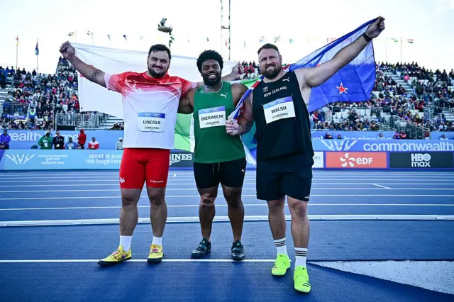 Third-placed England's Scott Lincoln, first-placed Nigeria's Chukwuebuka Enekwechi and second-placed New Zealand's Tom Walsh celebrate