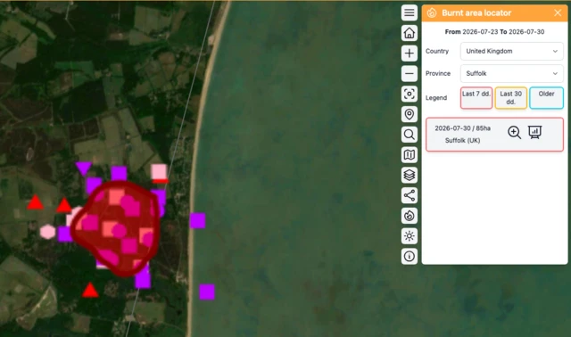 A satellite map of the wildfire on the suffolk coast, it shows a large red circle area that has ben burned near the sea. A locator on the right shows an area of 85 hectares has been estimated burned in the 7 days.