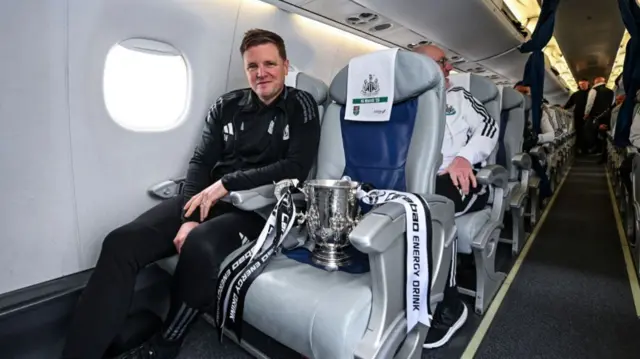 Newcastle United Head Coach Eddie Howe travels back to Newcastle upon Tyne with the Carabao Cup on March 17, 2025 in Newcastle upon Tyne, England