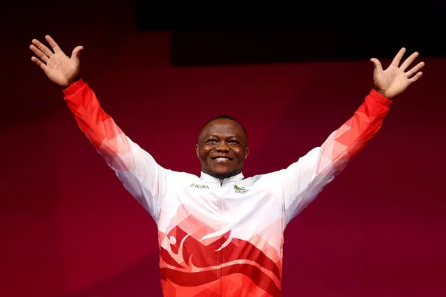 Silver medalist Cyrille Tchatchet II of Team England poses for a photo during the medal ceremony for the Men's 110kg Weightlifting