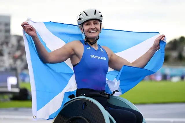 Melanie Woods of Team Scotland celebrates victory in the Women's 1500m T54 Final