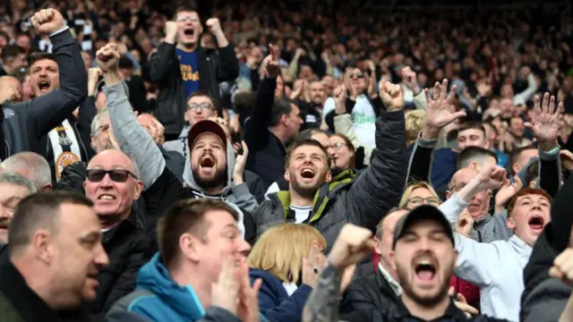 Newcastle fans celebrate a first half goal during their 6-1 victory during the Premier League match between Newcastle United and Tottenham Hotspur at St. James Park on April 23, 2023 in Newcastle upon Tyne, England