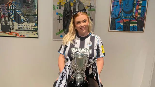 Photo of Kendall Rowan with Carabao Cup trophy