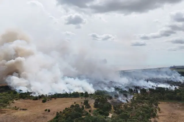 Smoke rises from a wildfire at Dunwich Heath, near Leiston.