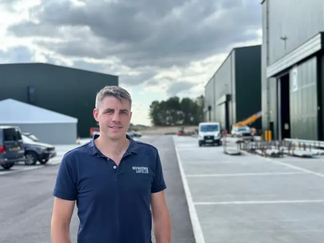 Harvey Mash outside the stages at Bovingdon Airfield Studios