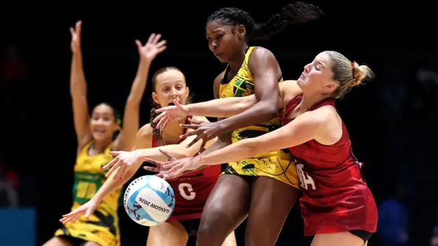 Abigale Sutherland of Team Jamaica and Bethan Dyke of Team Wales battle for possession