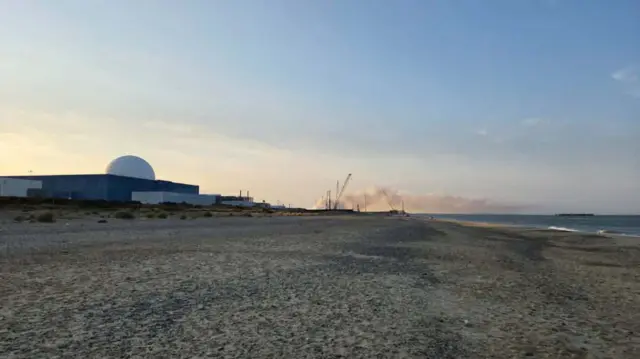 Smoke plumes seen from Sizewell beach, with the nuclear station on the left.