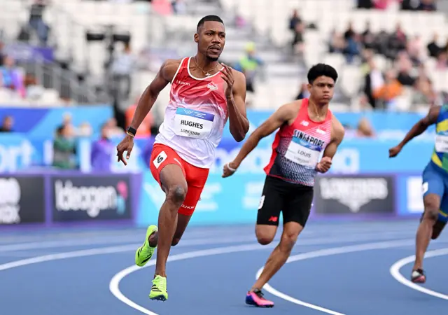 Zharnel Hughes of Team England competes in the Men's 200m Round 1 d