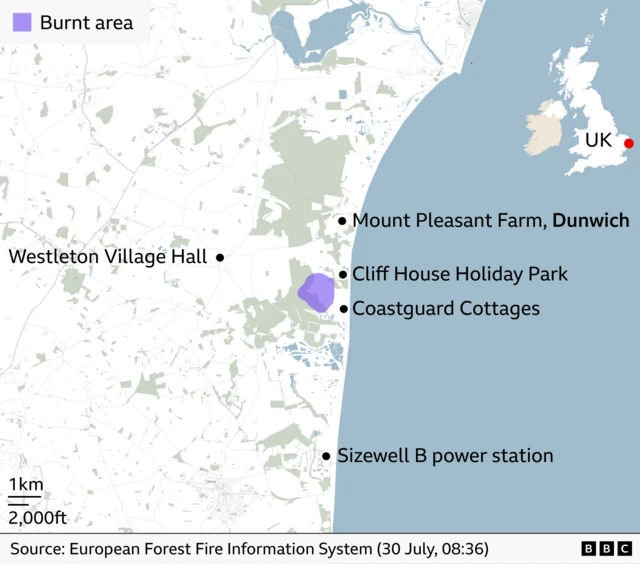 Map of the Suffolk coast near Dunwich showing the location of a burnt area highlighted in purple. The affected area lies inland from the coast, between Cliff House Holiday Park and Coastguard Cottages, north of Sizewell B power station and east of Westleton Village Hall. An inset map of the UK marks the location on the east coast of England.
