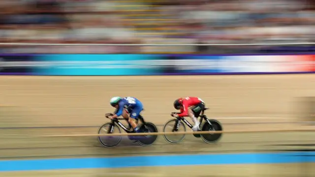 Cyclists on track in the velodrome with a blurred background