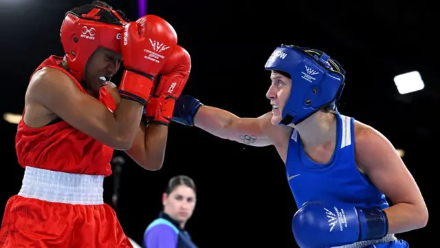 Northern Ireland's Michaela Walsh fights Fiji's Jasmine Daunakamakama in the Commonwealth Games semi-finals