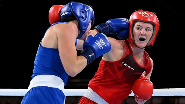 England boxer Sacha Hickey, right, fighting Australia's Eve Bryson in the women's 65kg category of the Commonwealth Games semi-finals