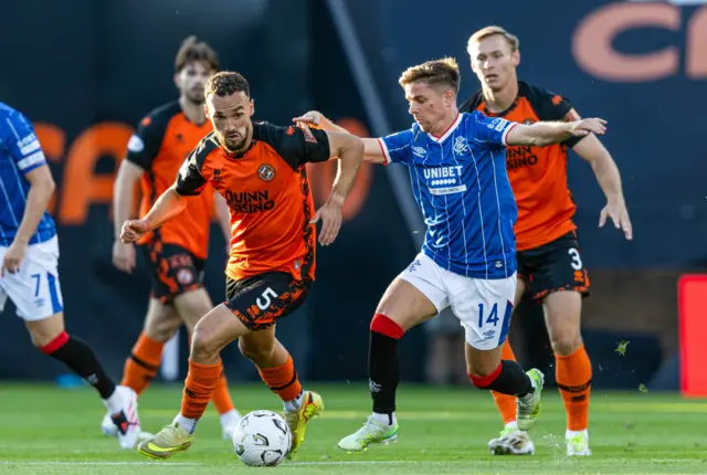 Cammy Devlin battles for possession