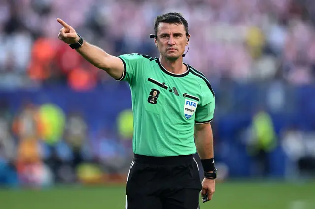 Referee Ilgiz Tantashev gestures