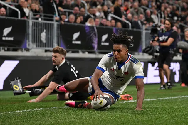 Theo Attissogbe of France scores his team's fourth try