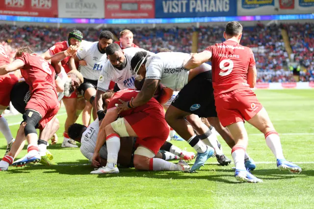Elia Canakaivata of Fiji scores a try