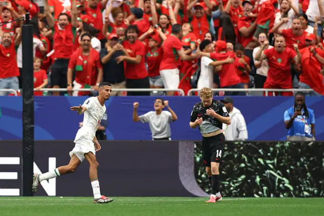 Azzedine Ounahi celebrates in front of Morocco fans