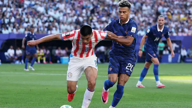 Diego Gomez controls the ball against Desire Doue