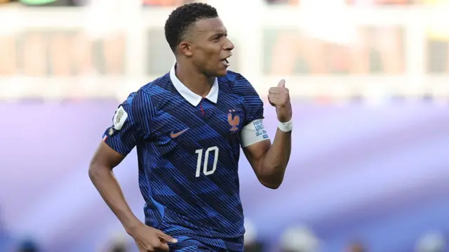 Kylian Mbappe celebrates scoring