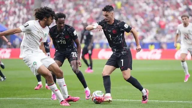 Stephen Eustaquio of Canada drives the ball
