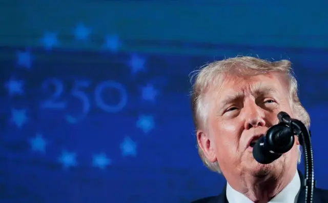 Donald Trump speaks into a microphone in front of a blue background. The number 250 is surrounded by a ring of stars on the blue back drop