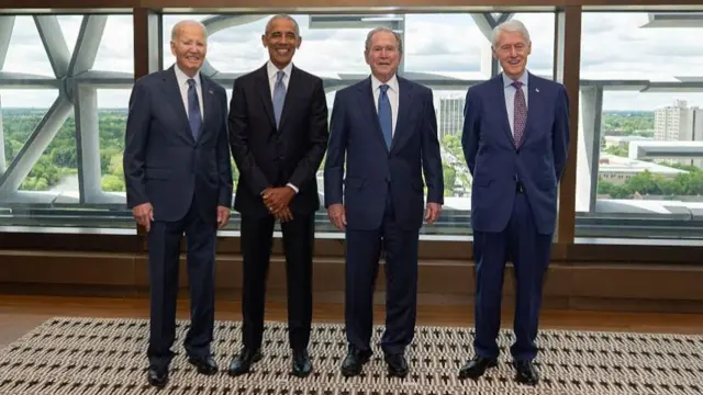 From left to right - Former U.S. presidents Joe Biden, Barack Obama, George W. Bush and Bill Clinton pose ahead of the dedication ceremony for the opening of the Barack Obama Presidential Center.