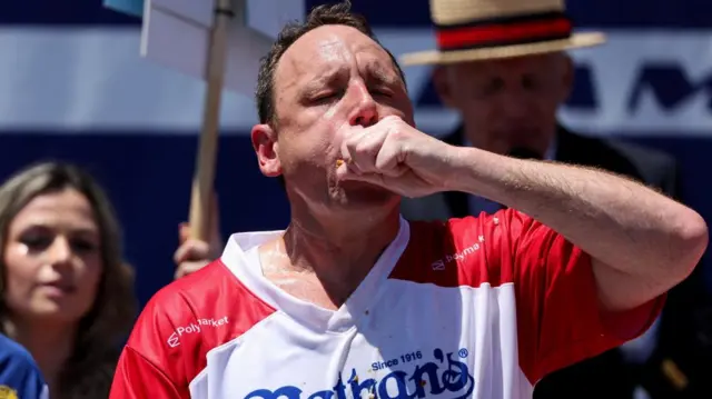 Joey Chestnut participates in the 2026 Nathan's Famous International Hot Dog Eating Contest, at Coney Island, Brooklyn in New York City, U.S., July 4, 2026.