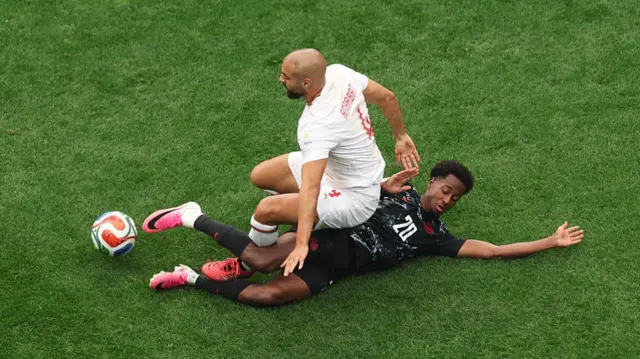 Canada and Morocco players compete for the ball