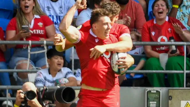 Josh Adams celebrates his try