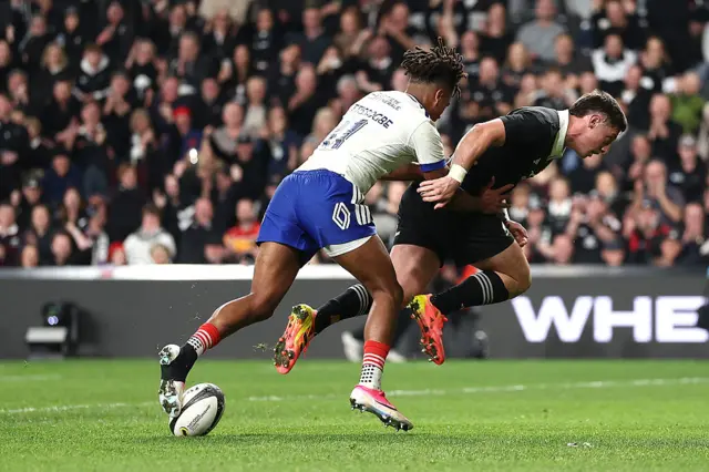 Cam Roigard of the New Zealand All Blacks scores a try during the Nations Championship match between New Zealand All Blacks and France