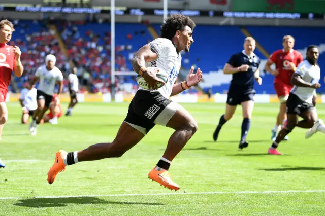 Selestino Ravutaumada of Fiji runs in to score a try