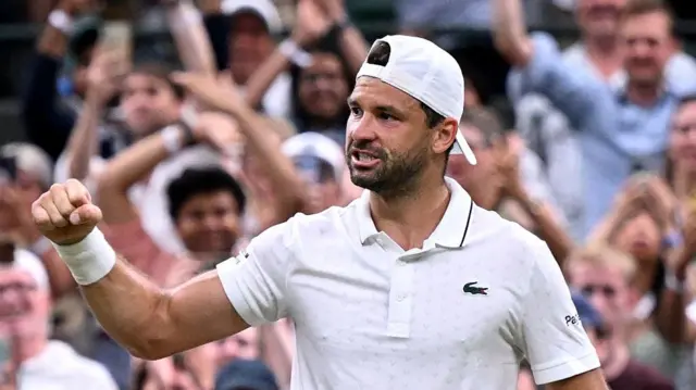 Grigor Dimitrov celebrates winning in front of crowd