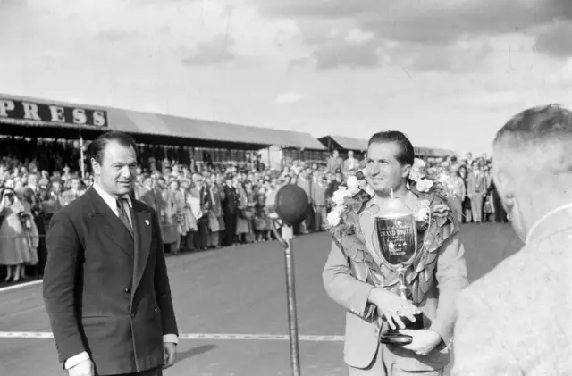 Alberto Ascari celebrates winning the British GP in 1953