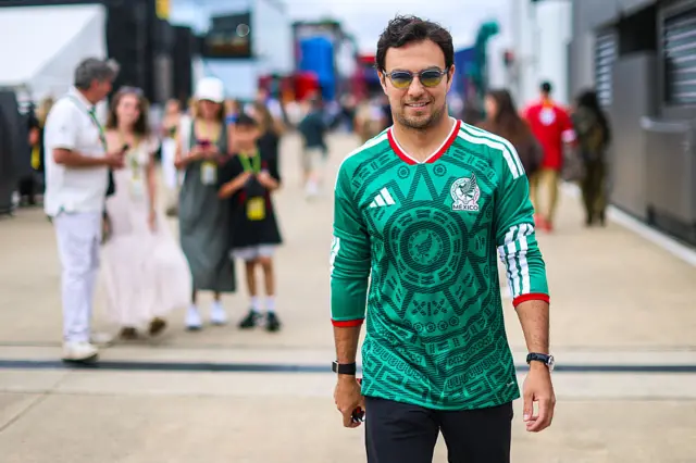 Sergio Perez wears a Mexico shirt to the Silverstone paddock