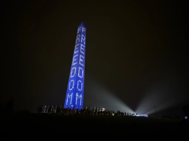 The Washington Monument in Washington DC is lit up with the phrase Freedom ahead of President Trump's speech during a Freedom 250 event on Saturday night.