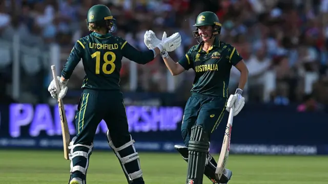 Phoebe Litchfield and Australia's Beth Mooney celebrate
