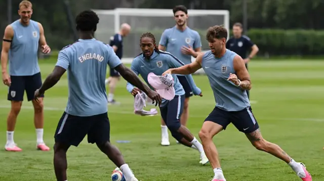 England's defender #25 Djed Spence and England's defender #05 John Stones take part in a training session at the Pumas training grounds in Mexico City on July 4, 2026, on the eve of the 2026 World Cup round of 16 football match between Mexico and England.