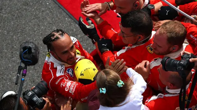 Lewis Hamilton celebrating with ferrari and his family