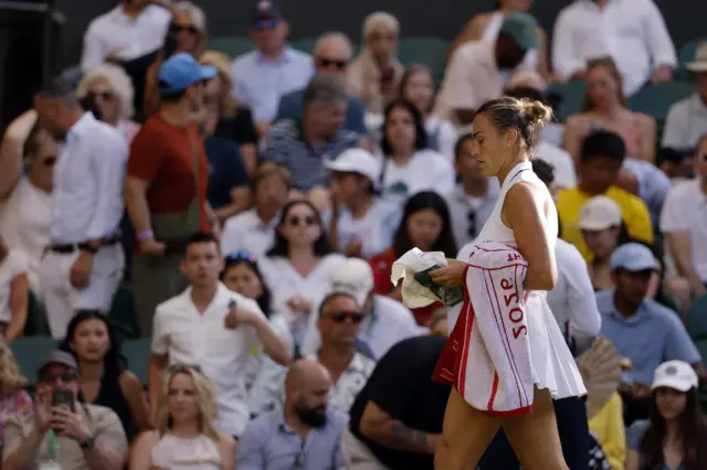 Aryna Sabalenka leaves the court