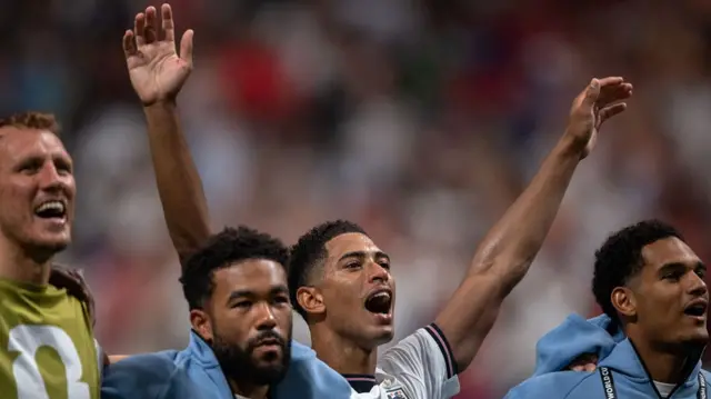 Jude Bellingham of England sings Wonderwall with fans following victory in the FIFA World Cup 2026 Round Of 32 match between England and Congo DR at Atlanta Stadium on July 01, 2026 in Atlanta, Georgia.