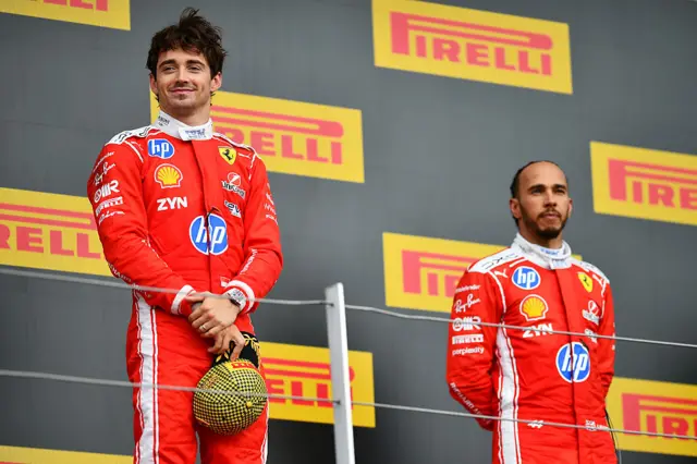 Charles Leclerc and Lewis Hamilton on the podium
