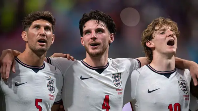 John Stones, Declan Rice and Anthony Gordon of England sing Wonderwall with fans following the FIFA World Cup 2026 Round Of 32 match between England and Congo DR at Atlanta Stadium on July 01, 2026 in Atlanta, Georgia.