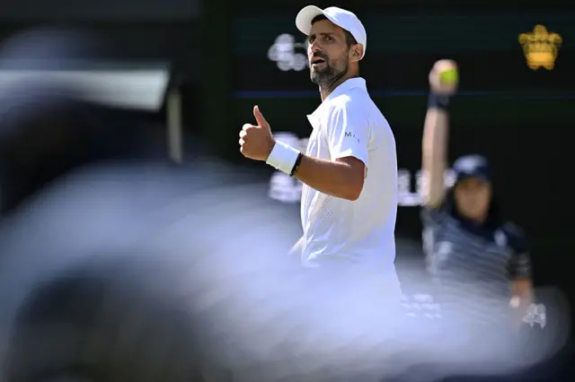 Novak Djokovic gives a thumbs up
