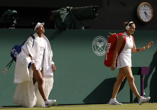 Naomi Osaka and Aryna Sabalenka walk on to court