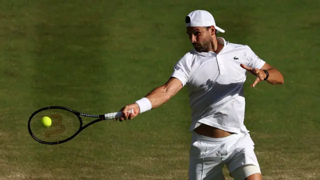 Grigor Dimitrov hits a forehand