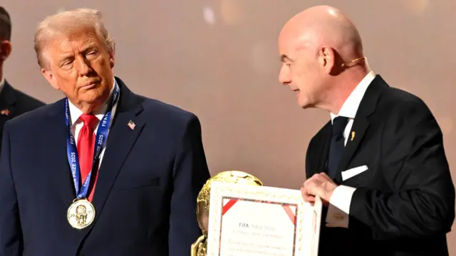 President Donald Trump receives Fifa Peace Prize from Fifa president Gianni Infantino