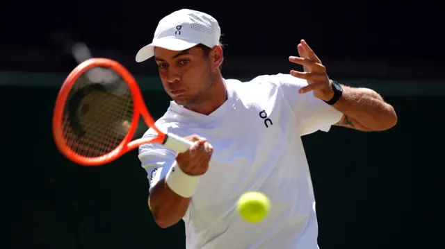 Flavio Cobolli hits a forehand