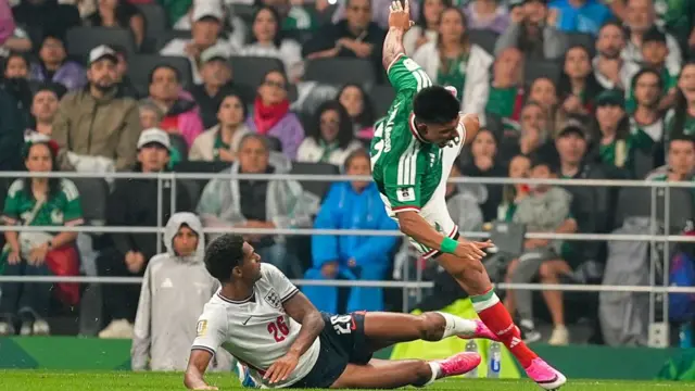 Jarell Quansah (26) of England tackles Jesus Gallardo (23) of Mexico which results in a red card during the FIFA World Cup 2026 Round of 16 match between Mexico and England at Mexico Stadium (Estadio Azteca) in Mexico City, Mexico on July 05, 2026