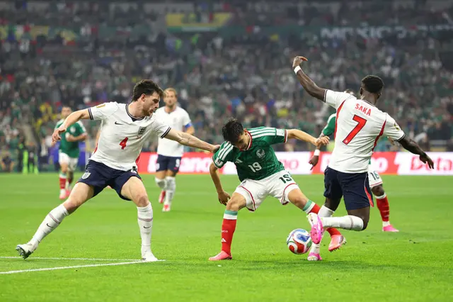 Declan Rice and Bukayo Saka challenge for the ball