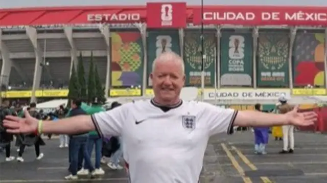 Paul Clegg is shown in front of a football stadium